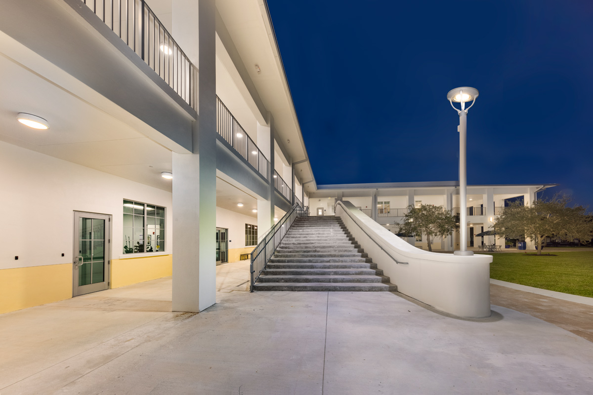Architectural dusk photo of outdoor stairs at Palmer Trinity student center in Miami, FL